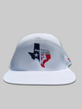 White cap with Texas design on grass and fence background