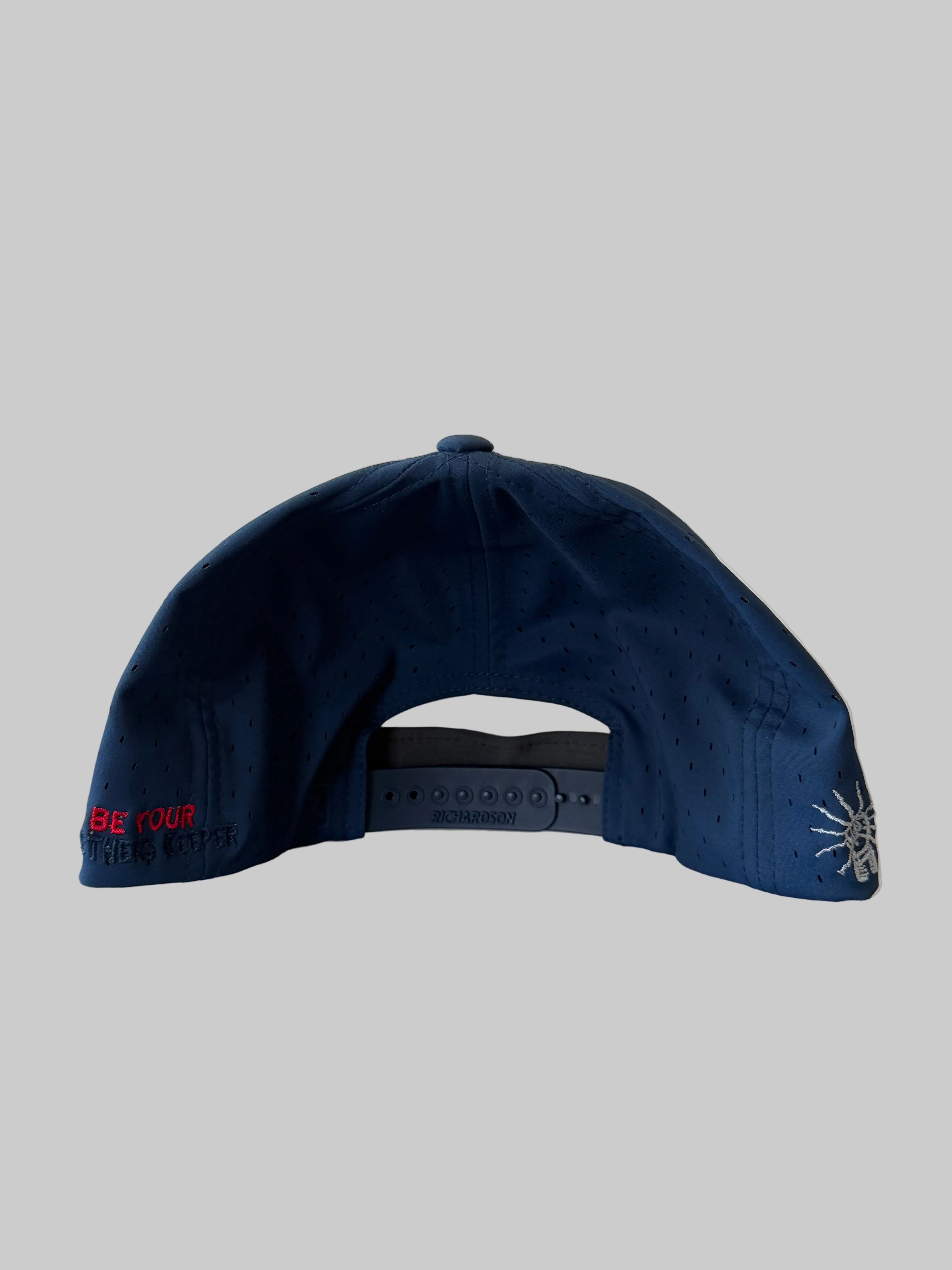 Navy blue cap with text on a light background